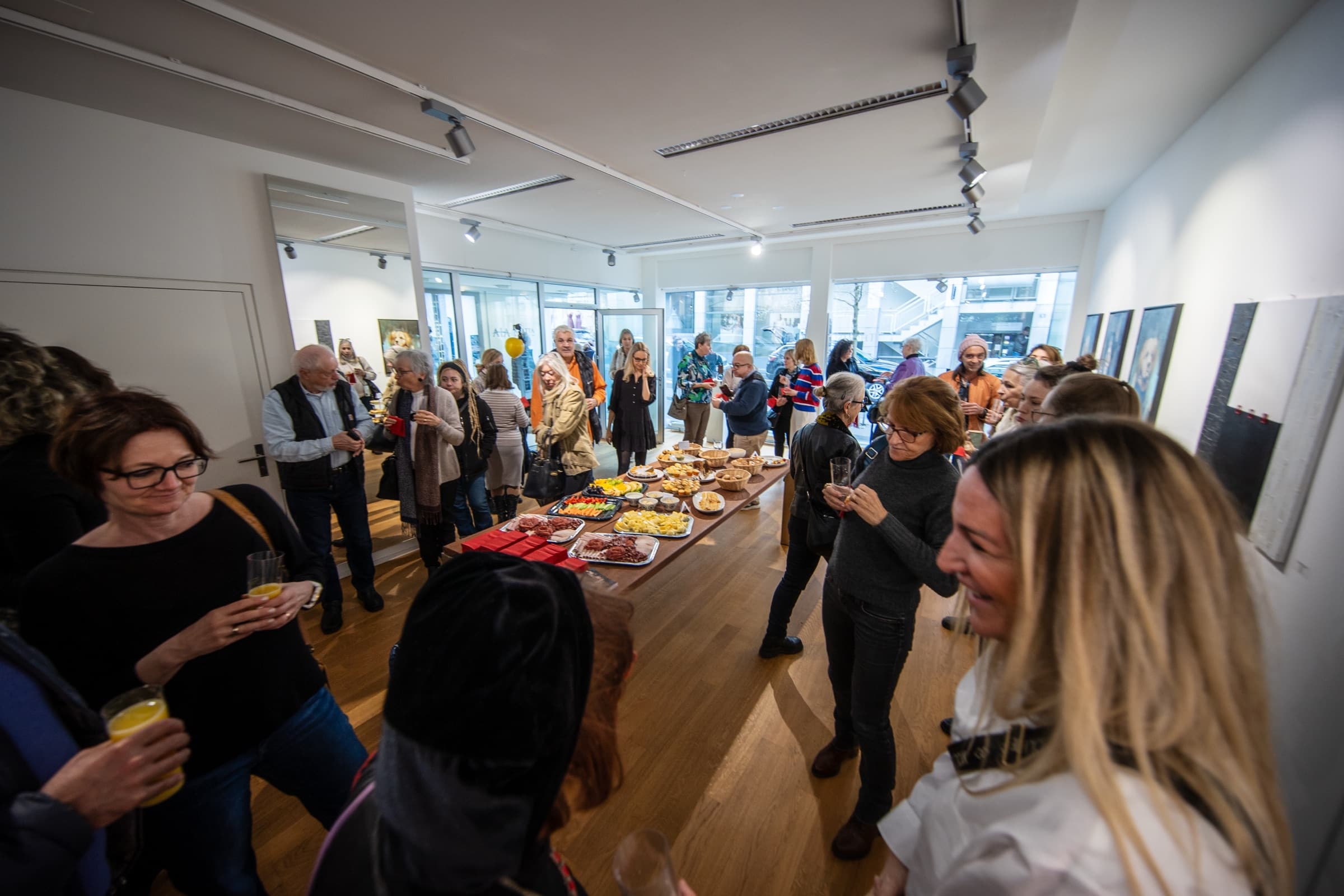 Guests at an opening at Thomson Gallery